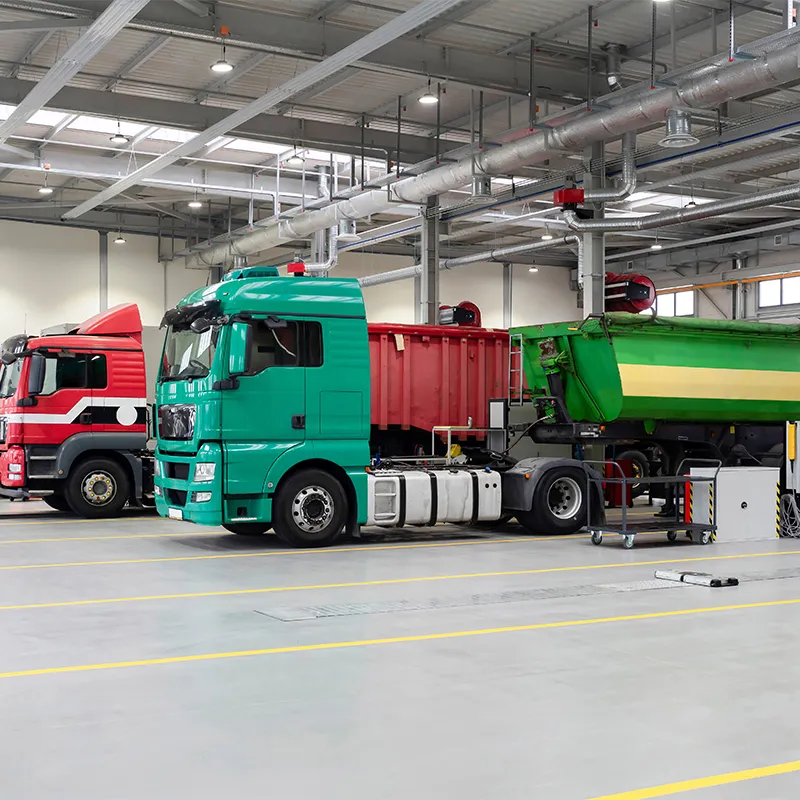Fleet of heavy duty trucks parked in a commercial depot — Al Saha performs AdBlue delete for trucks across the UAE