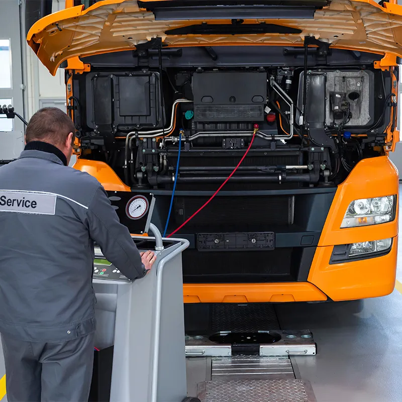 Al Saha technician performing truck diagnostics on a heavy commercial vehicle using OEM-level diagnostic equipment